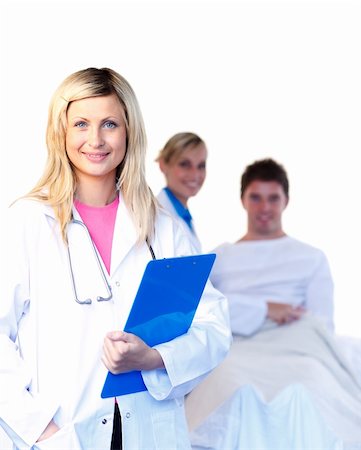 Portrait of a beautiful doctor with a colleague and a patient in the background Stock Photo - Budget Royalty-Free & Subscription, Code: 400-05155586