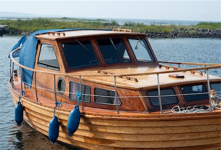 detail of boat and people - Wooden Fishing boat docked at a fishing town in Sweden Stock Photo - Budget Royalty-Free & Subscription, Code: 400-05156348