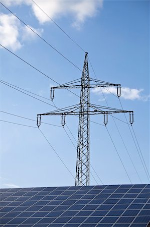 electricity pole silhouette - solar panels and a pylon on a sunny day Foto de stock - Super Valor sin royalties y Suscripción, Código: 400-05156844