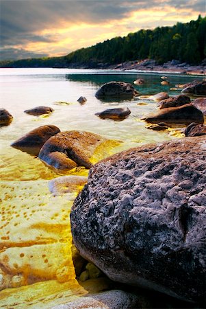 simsearch:400-05150811,k - Rocks in clear golden water of Georgian Bay at Bruce peninsula Ontario Canada Stock Photo - Budget Royalty-Free & Subscription, Code: 400-05157040