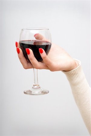 A woman holds her glass of wine up in the air. Stock Photo - Budget Royalty-Free & Subscription, Code: 400-05157156