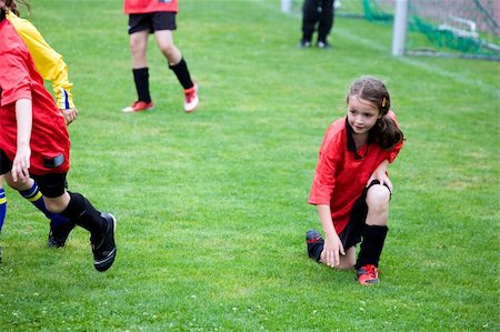 girl playing football Stock Photo - Budget Royalty-Free & Subscription, Code: 400-05157337