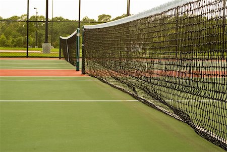 brand new tennis court net with vegetation in background Stock Photo - Budget Royalty-Free & Subscription, Code: 400-05157421