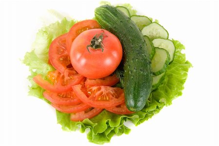simsearch:400-07822704,k - Fresh vegetables: cucumbers salad and tomatoes on plate Photographie de stock - Aubaine LD & Abonnement, Code: 400-05158105