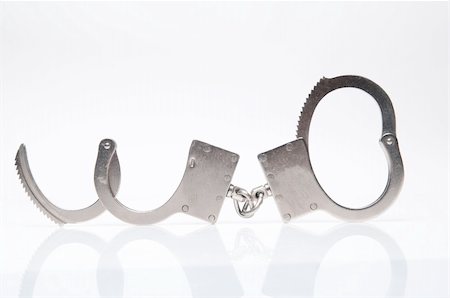 simsearch:400-05300234,k - Handcuffs Fotografie stock - Microstock e Abbonamento, Codice: 400-05158447