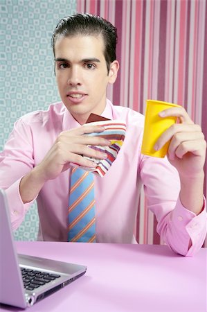 Businessman young eating fast food menu at office with laptop Stock Photo - Budget Royalty-Free & Subscription, Code: 400-05158523