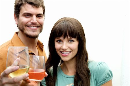 friends gathering christmas - A couple toasting toward the camera with wine Stock Photo - Budget Royalty-Free & Subscription, Code: 400-05158575
