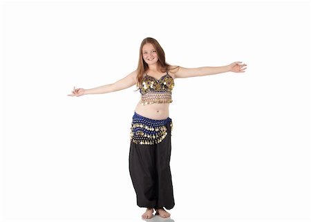 Young Caucasian belly dancing girl in beautiful decorated clothes on white background and reflective floor. Not isolated Stock Photo - Budget Royalty-Free & Subscription, Code: 400-05158744