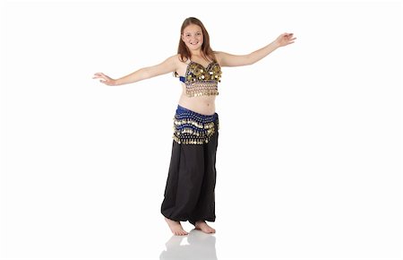 simsearch:400-04627234,k - Young Caucasian belly dancing girl in beautiful decorated clothes on white background and reflective floor. Not isolated Foto de stock - Super Valor sin royalties y Suscripción, Código: 400-05158745