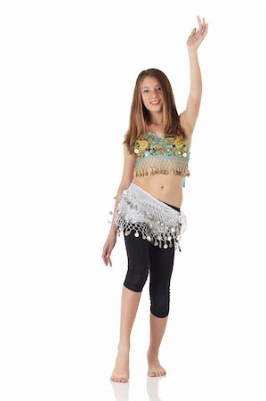 simsearch:859-03598912,k - Young Caucasian belly dancing girl in beautiful decorated clothes on white background and reflective floor. Not isolated Stock Photo - Budget Royalty-Free & Subscription, Code: 400-05158785