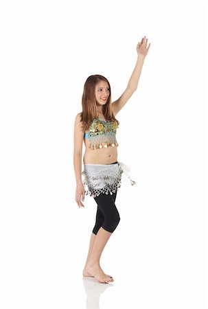 simsearch:859-03598912,k - Young Caucasian belly dancing girl in beautiful decorated clothes on white background and reflective floor. Not isolated Stock Photo - Budget Royalty-Free & Subscription, Code: 400-05158786