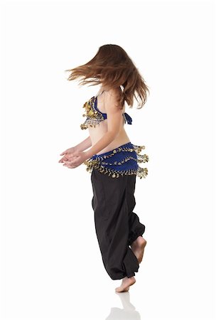 Young Caucasian belly dancing girl in beautiful decorated clothes on white background and reflective floor. Not isolated Stock Photo - Budget Royalty-Free & Subscription, Code: 400-05158793