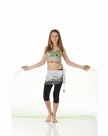 simsearch:400-04627234,k - Young Caucasian belly dancing girl in beautiful decorated clothes on white background and reflective floor. Not isolated Foto de stock - Super Valor sin royalties y Suscripción, Código: 400-05158856