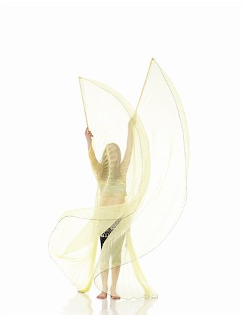 simsearch:400-04627234,k - Young Caucasian belly dancing girl in beautiful decorated clothes on white background and reflective floor. Not isolated Foto de stock - Super Valor sin royalties y Suscripción, Código: 400-05158898