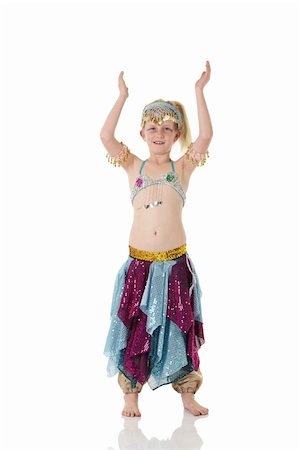 Young Caucasian belly dancing girl in beautiful decorated clothes on white background and reflective floor. Not isolated Foto de stock - Super Valor sin royalties y Suscripción, Código: 400-05158902