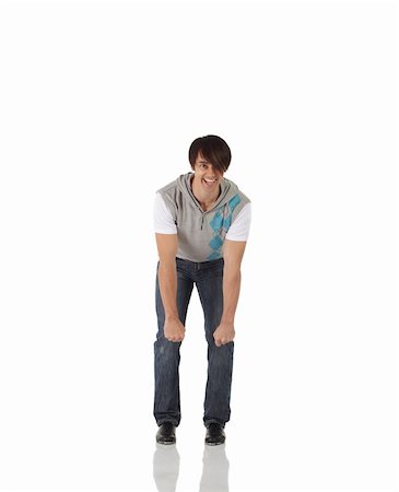 Single Caucasian male tap dancer wearing jeans showing various steps in studio with white background and reflective floor. Not isolated Stock Photo - Budget Royalty-Free & Subscription, Code: 400-05158910