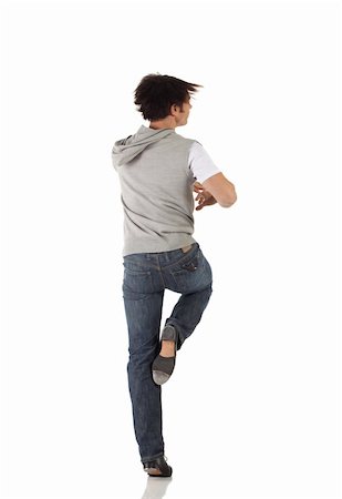 Single Caucasian male tap dancer wearing jeans showing various steps in studio with white background and reflective floor. Not isolated Stock Photo - Budget Royalty-Free & Subscription, Code: 400-05158912