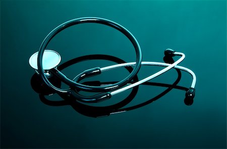 single stethoscope with reflection in turquoise tones Stock Photo - Budget Royalty-Free & Subscription, Code: 400-05159422