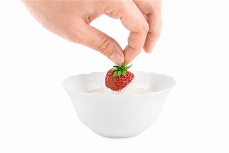 simsearch:400-03993668,k - Hand with strawberry in cream on white Foto de stock - Super Valor sin royalties y Suscripción, Código: 400-05159628