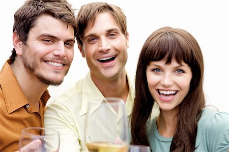 friends gathering christmas - A group of people at a party drinking and having fun Stock Photo - Budget Royalty-Free & Subscription, Code: 400-05159674