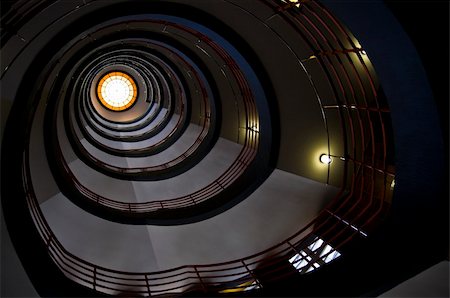looking upwards in a beautiful old spiral staircase Foto de stock - Super Valor sin royalties y Suscripción, Código: 400-05159838