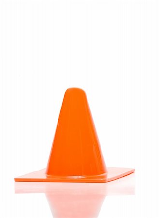 simsearch:400-08093747,k - Orange traffic cone for the directioning of traffic. Fotografie stock - Microstock e Abbonamento, Codice: 400-05159833