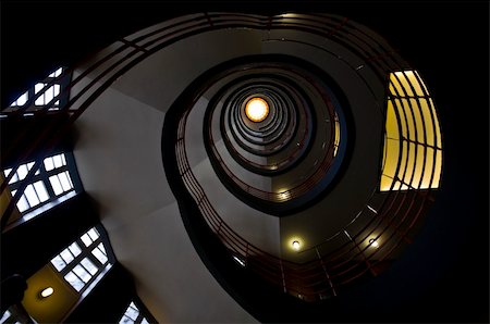 looking upwards in a beautiful old spiral staircase Foto de stock - Super Valor sin royalties y Suscripción, Código: 400-05159842