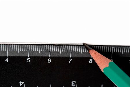 perspective macro - Pencil drawing a line over a black ruler on the white paper Stock Photo - Budget Royalty-Free & Subscription, Code: 400-05159946