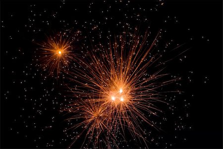 simsearch:400-07915108,k - Fireworks exploding in the dark of the evening sky. Stock Photo - Budget Royalty-Free & Subscription, Code: 400-05150158