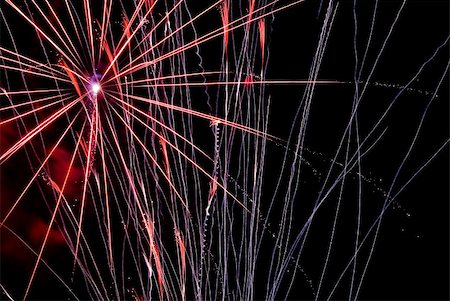 simsearch:400-04419970,k - Fireworks exploding in the dark of the evening sky. Stock Photo - Budget Royalty-Free & Subscription, Code: 400-05150159