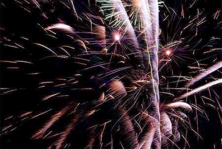 simsearch:400-05701008,k - Fireworks exploding in the dark of the evening sky. Stock Photo - Budget Royalty-Free & Subscription, Code: 400-05150152