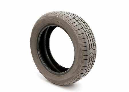 Tyre of a car isolated on white background Stock Photo - Budget Royalty-Free & Subscription, Code: 400-05150211