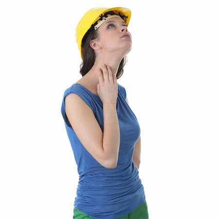 simsearch:400-04288994,k - Young female architect or builder wearing a yellow hart hat on a construction site Stock Photo - Budget Royalty-Free & Subscription, Code: 400-05150954