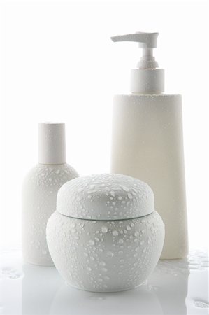 plastic bathtub - Three white cosmetic bottles with water drops, stand on a white background Stock Photo - Budget Royalty-Free & Subscription, Code: 400-05152305