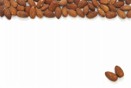 simsearch:400-04846153,k - An almond pile at the top and two seperate almonds on the bottom. Stock Photo - Budget Royalty-Free & Subscription, Code: 400-05152424