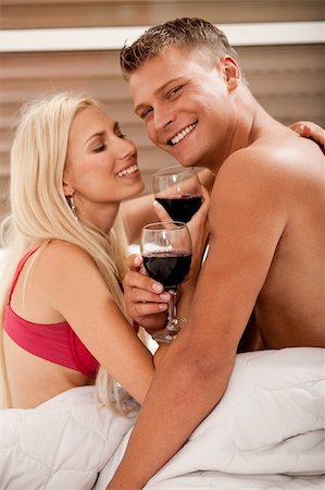 Couple sharing wine in bed Stock Photo - Budget Royalty-Free & Subscription, Code: 400-05152474