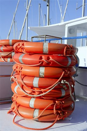Stacked orange rescue round buoy, sea marine lifesaver Stock Photo - Budget Royalty-Free & Subscription, Code: 400-05152540