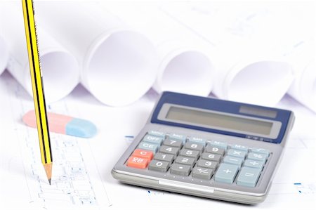 Construction plans, calculator and drawing tools. Shallow depth of field Foto de stock - Super Valor sin royalties y Suscripción, Código: 400-05152650