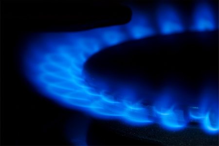 Closeup detail of natural gas flame on a stove Photographie de stock - Aubaine LD & Abonnement, Code: 400-05152694