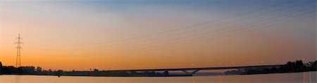 Panorama of the bridge against the sunset sky Stock Photo - Budget Royalty-Free & Subscription, Code: 400-05152774