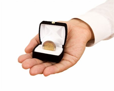 Man offering a coin in jewelry gift box - business concept Photographie de stock - Aubaine LD & Abonnement, Code: 400-05152918