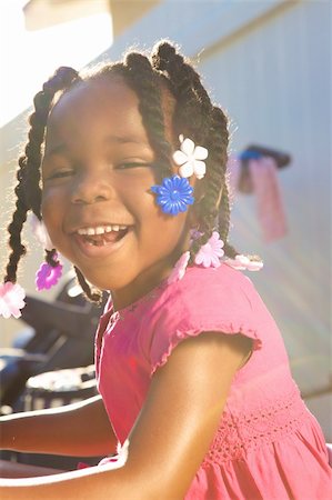 An adorable little african american girl in a pink shirt Stock Photo - Budget Royalty-Free & Subscription, Code: 400-05153083