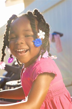 An adorable little african american girl in a pink shirt Photographie de stock - Aubaine LD & Abonnement, Code: 400-05153083