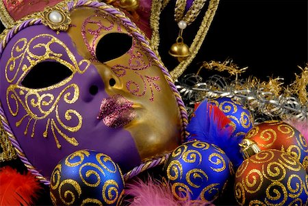 Beautiful Venetian mask on black background and christmas baubles with the similar golden motive Stock Photo - Budget Royalty-Free & Subscription, Code: 400-05153512