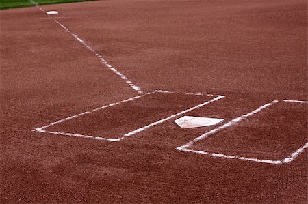 A close-up of the batters boxes and home plate on a vacant baseball diamond. Stockbilder - Microstock & Abonnement, Bildnummer: 400-05153979