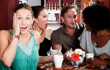 simsearch:400-04554624,k - Four adult gossiping friends meeting in a coffee house Stock Photo - Budget Royalty-Free & Subscription, Code: 400-05164282