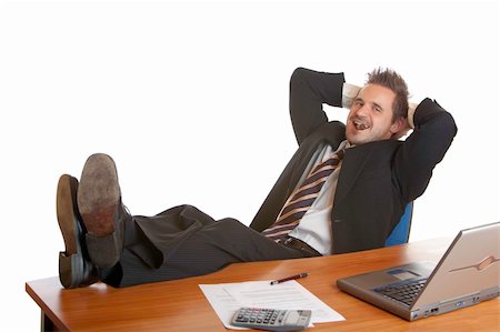 Businessman sitting on his desk and relax with a cuban cigar to reduce stress Stock Photo - Budget Royalty-Free & Subscription, Code: 400-05164354