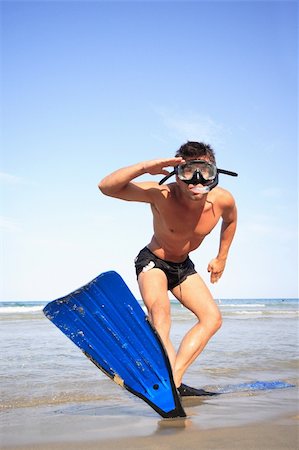 Funny young man ready for fun at sunny beach Foto de stock - Royalty-Free Super Valor e Assinatura, Número: 400-05165030