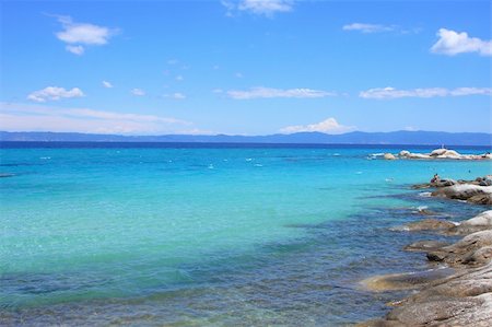 Portokali beach, Halkidiki, Greece with Athos mount on background Stockbilder - Microstock & Abonnement, Bildnummer: 400-05165071