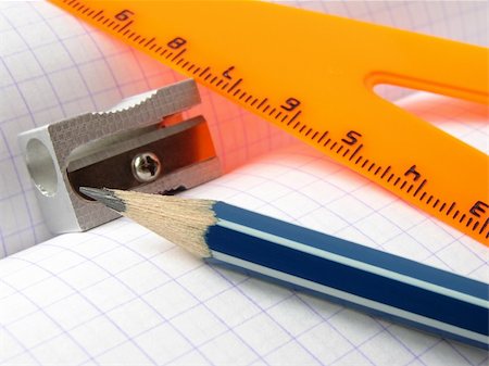 simsearch:400-05294430,k - pencil and sharpener with triangle on the workbook page Fotografie stock - Microstock e Abbonamento, Codice: 400-05165226